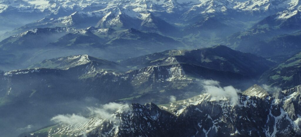 An overhead image of the Alps in Switzerland on a sunny day.